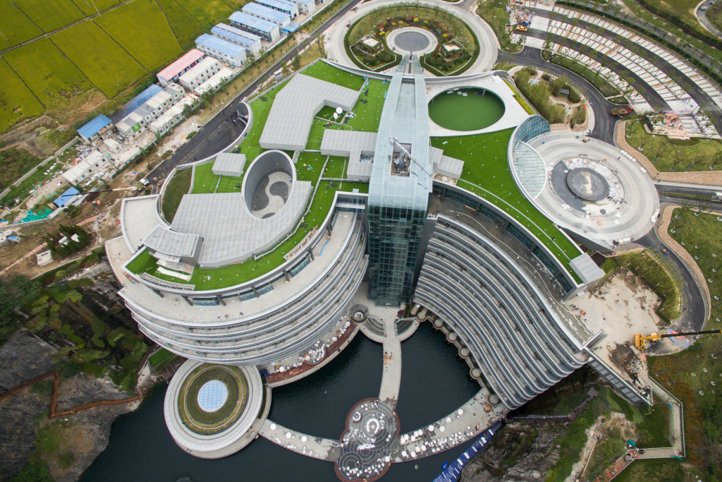 An aerial view of the luxury hotel InterContinental Shanghai Wonderland built inside a deserted quarry pit in southwestern Shanghai, China Wednesday, Oct. 10, 2018. The building has 18 floors, 16 of which are below ground including two submerged under water. After multiple delays, the hotel, designed by British firm Atkins, will finally open later this year.PHOTOGRAPH BY Feature China / Future Publishing (Photo credit should read Feature China/Future Publishing via Getty Images)