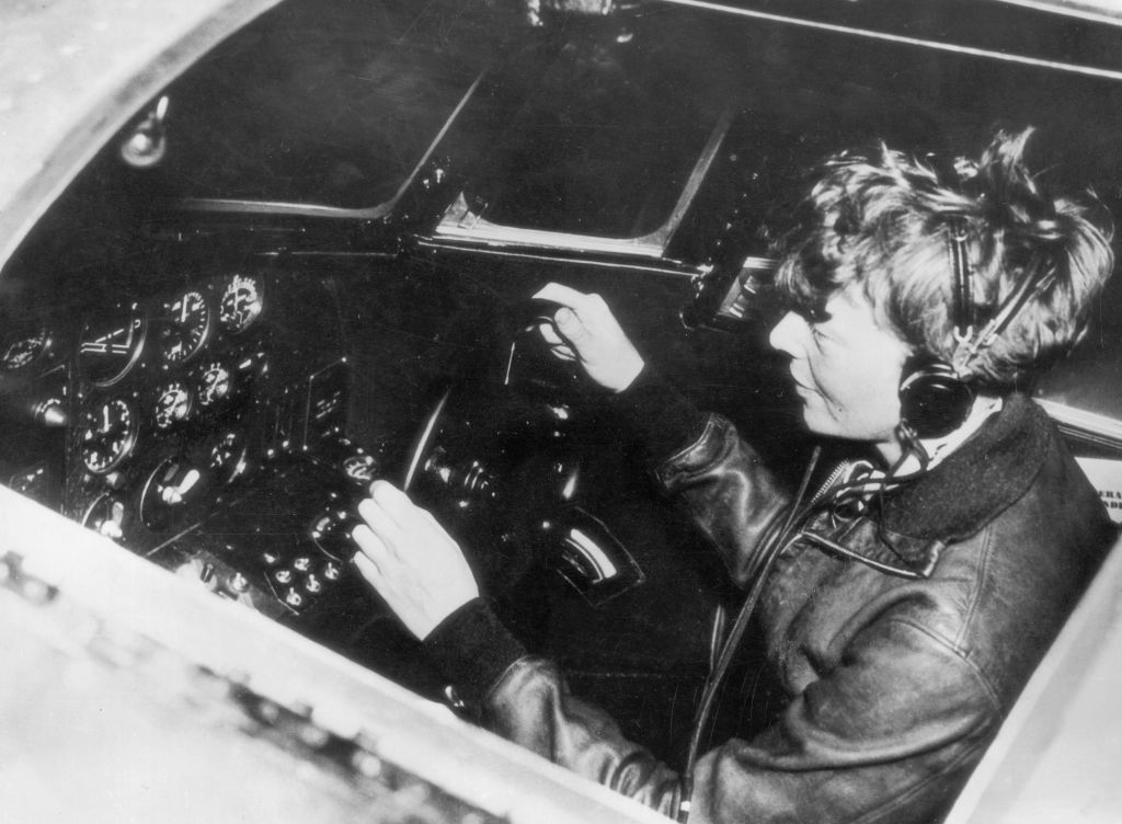 American aviatrix Amelia Earhart (1897 - 1937) operates the controls of a flying laboratory, circa 1935. (Photo by Keystone/Hulton Archive/Getty Images)