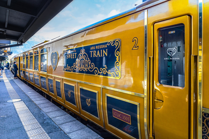 Yufuin, Japan - Nov 27 2022: ARU RESSHA is a luxury cruise train that lets passengers enjoy the wonders of Kyushu while savoring a delicious course meal onboard